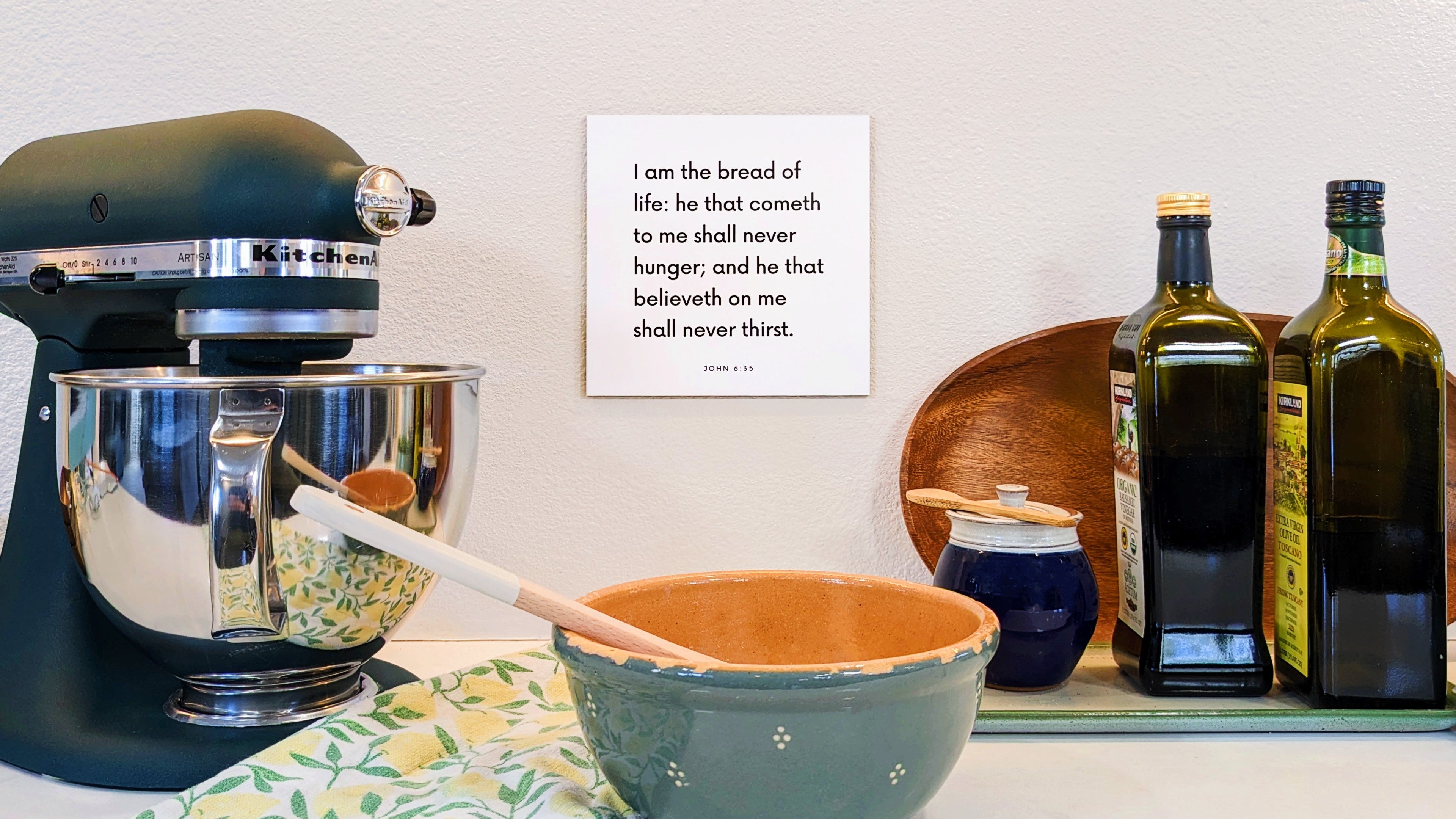 Kitchen counter with a scripture tile on the wall