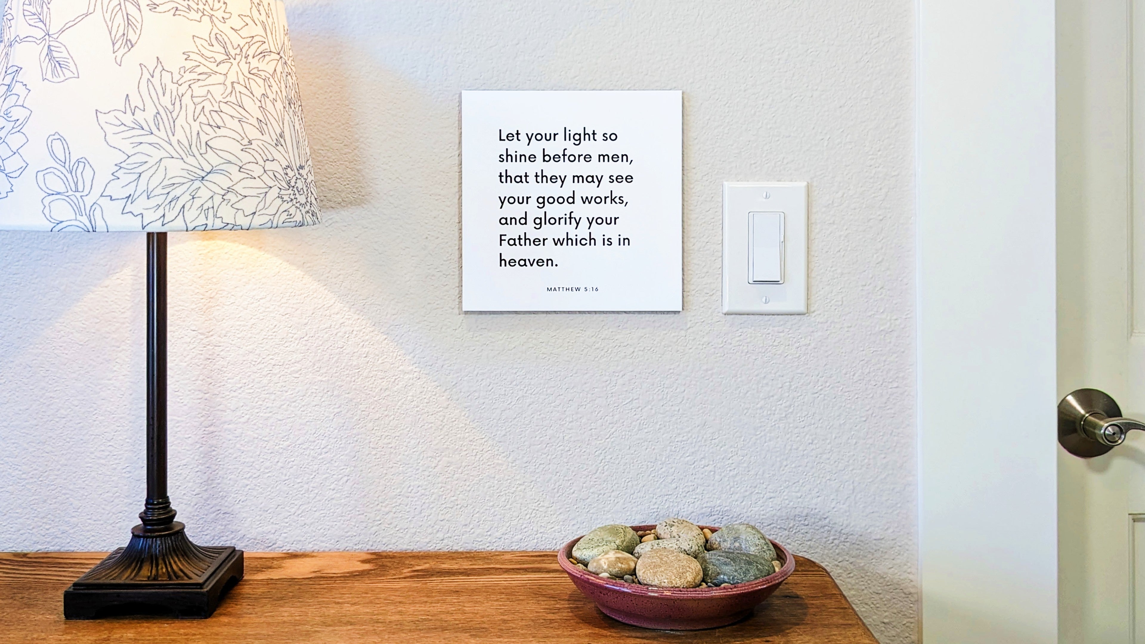Scripture tile mounted next to a lightswitch