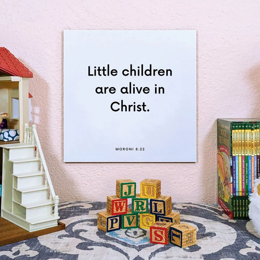 Playroom mouting of the scripture tile for Moroni 8:22 - "Little children are alive in Christ"