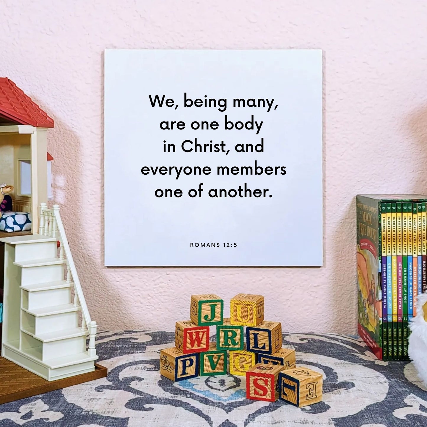 Playroom mouting of the scripture tile for Romans 12:5 - "We, being many, are one body in Christ"